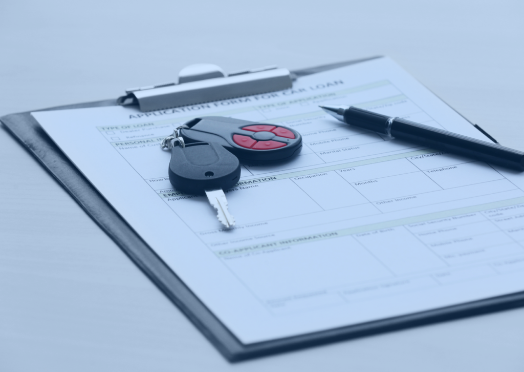 clipboard with keys and a pen